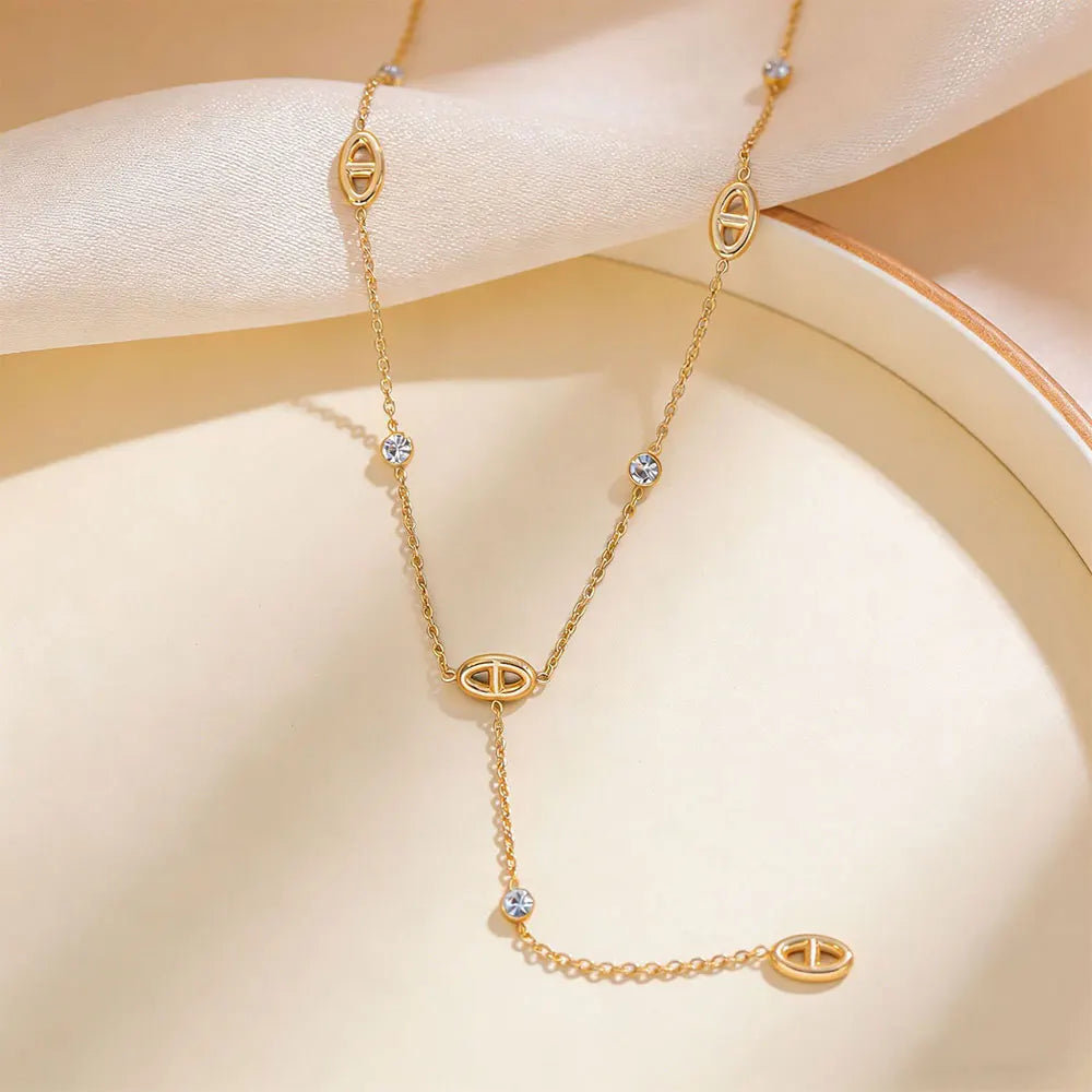 Collier long en Y maillons ovales – Doré avec strass